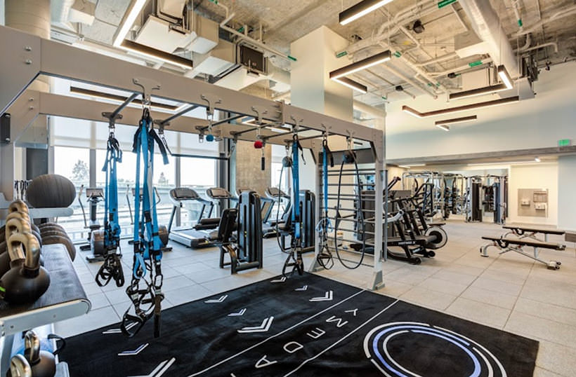 large fitness center with ample lighting throughout